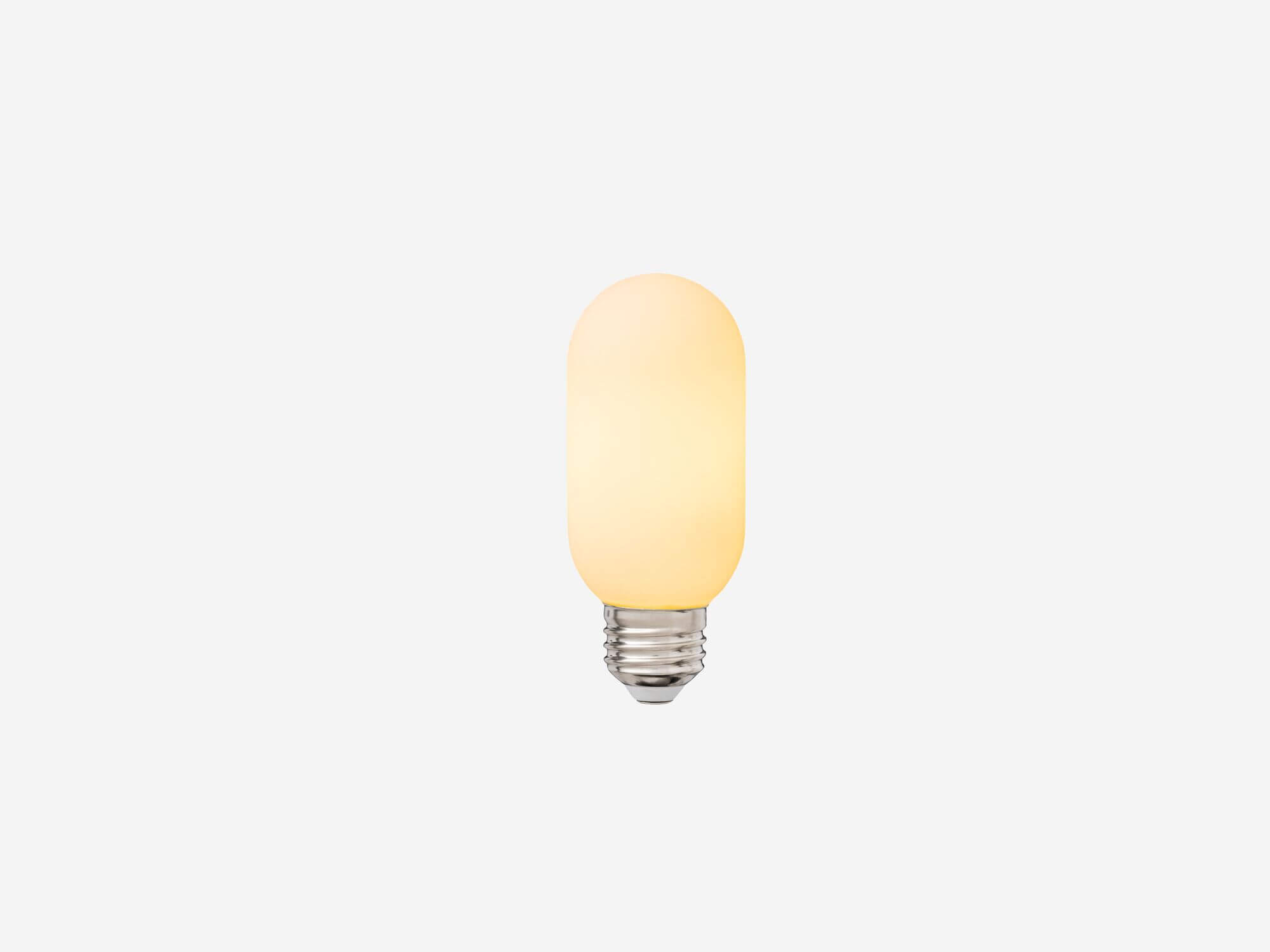 Front view of extra small matte white lightbulb with light on